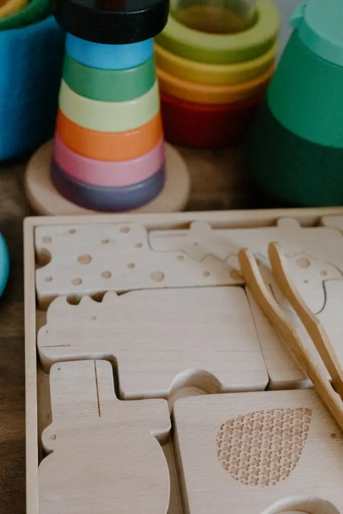 Close-up of vibrant wooden toys and puzzle pieces for kids. Ideal for playrooms.